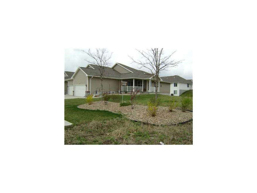 Front Exterior. Faces East with Green space