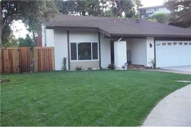 New sod & fence with gate.  Resurfaced driveway.  