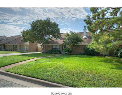 Exterior Front. Mature shade trees and a lush manicured lawn complement the charming exterior of this home.