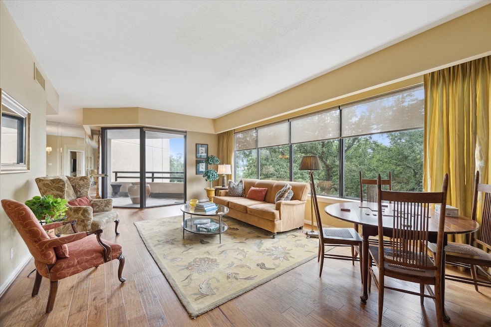 Spacious living area featuring new engineered wood floors.