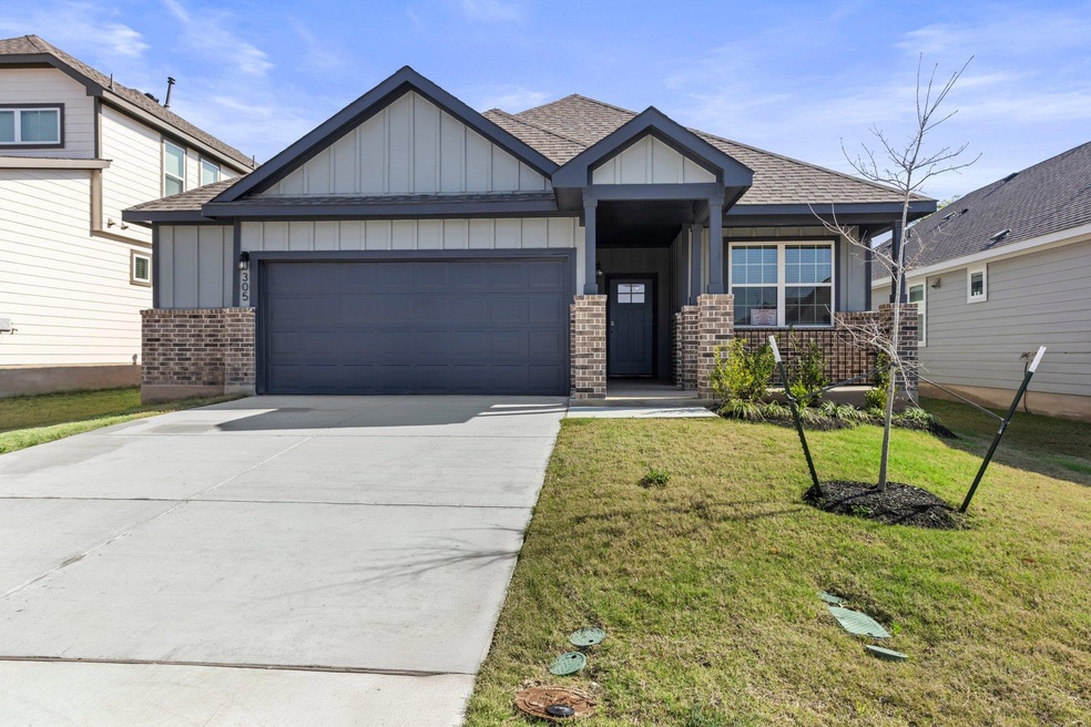 Craftsman-style home featuring roof with shingles
