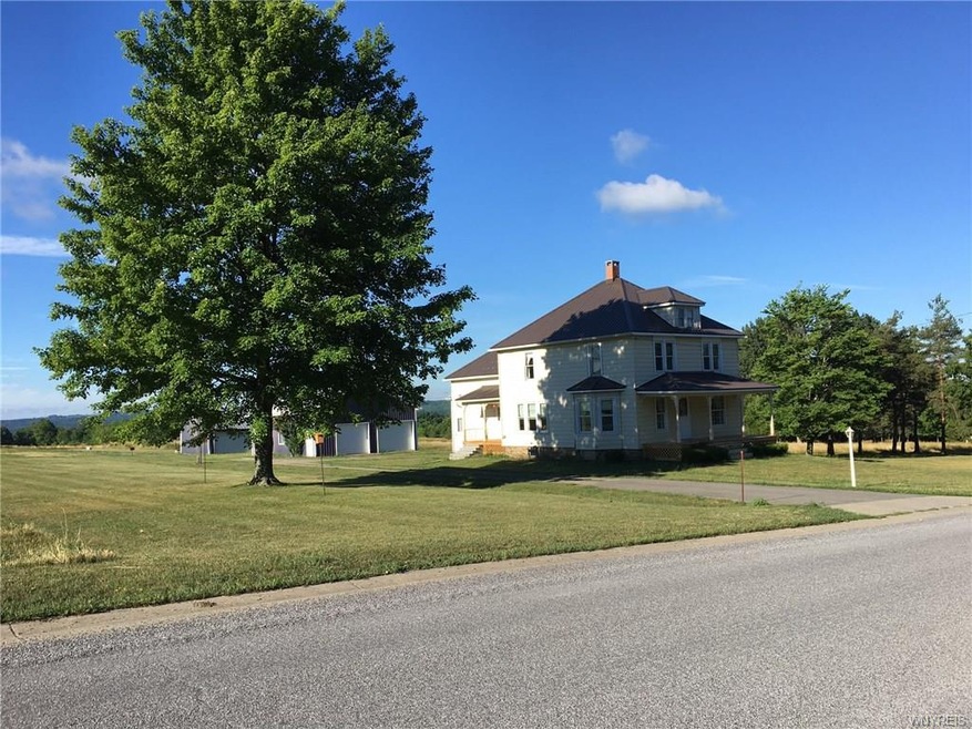 Classic Boston NY farmhouse on 5 fertile acres wit
