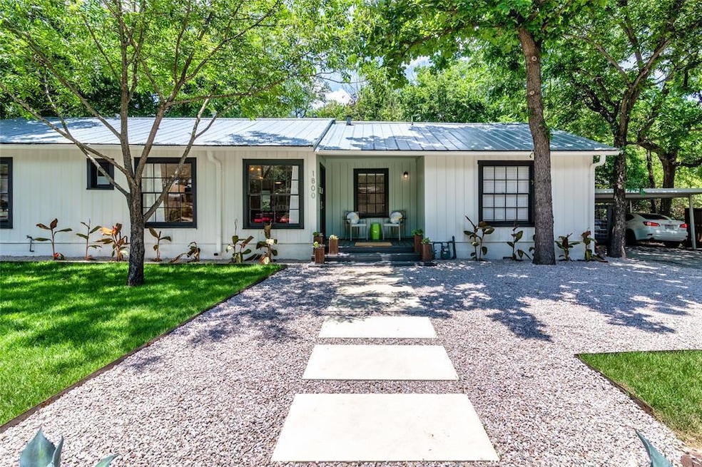 View of front of property featuring metal roof, a