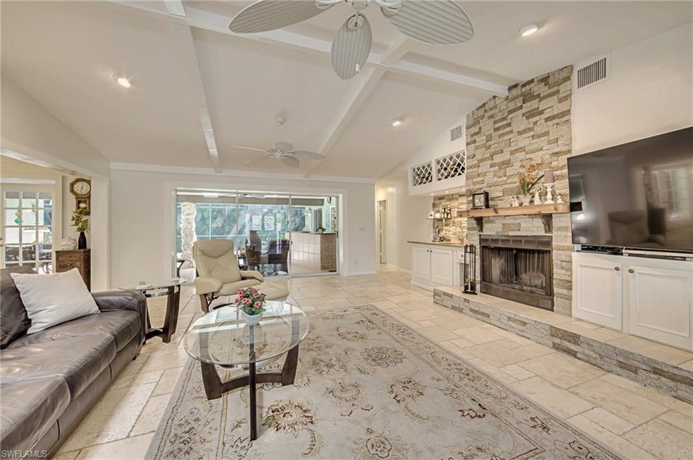 Spacious living room with access to lanai and pool
