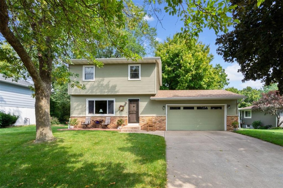 Brick partial and vinyl siding.