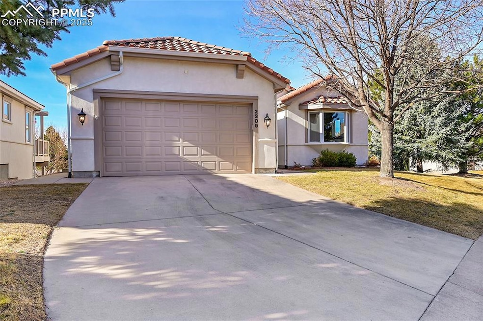 Mediterranean / Spanish-style house featuring a ti