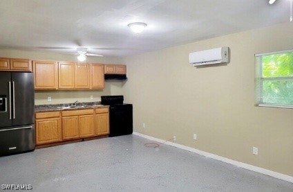 Kitchen featuring black appliances, a wall mounted