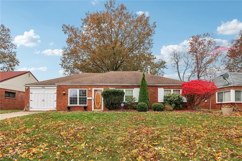 Ranch-style home with a front lawn and brick siding
