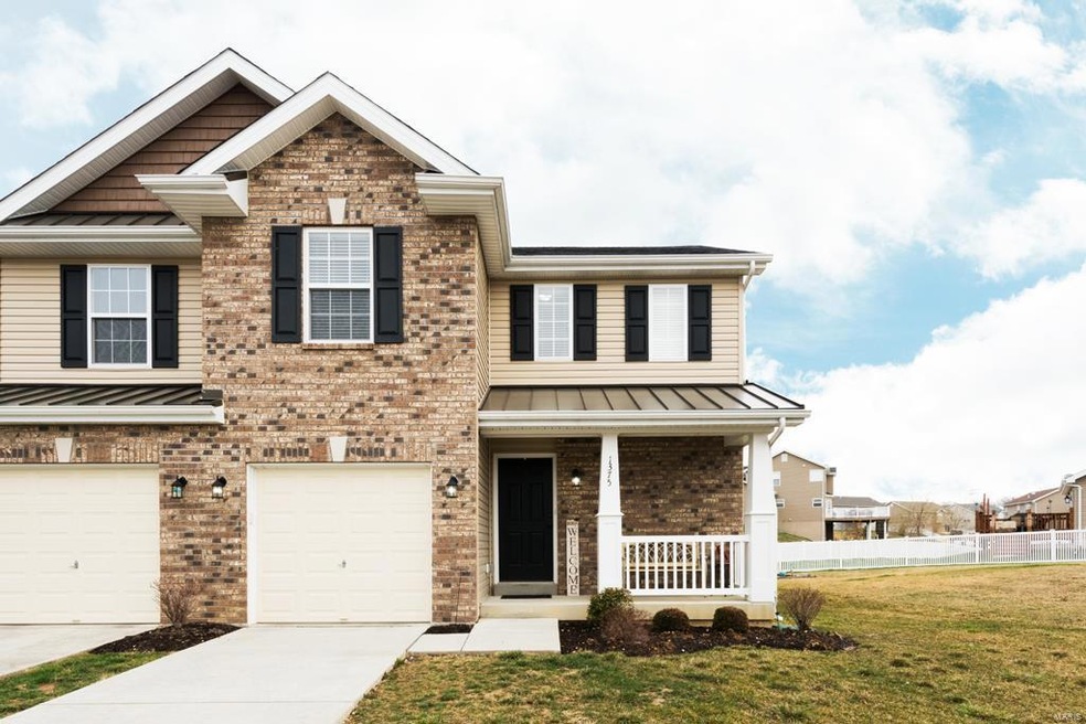 Gorgeous brick elevation! End unit at the end of a