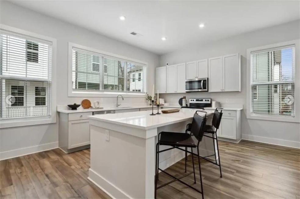 Kitchen with a center island, stainless steel appl