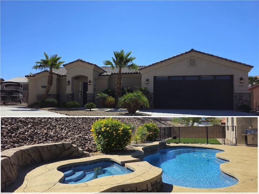 View of pool featuring an in-ground hot tub, grill