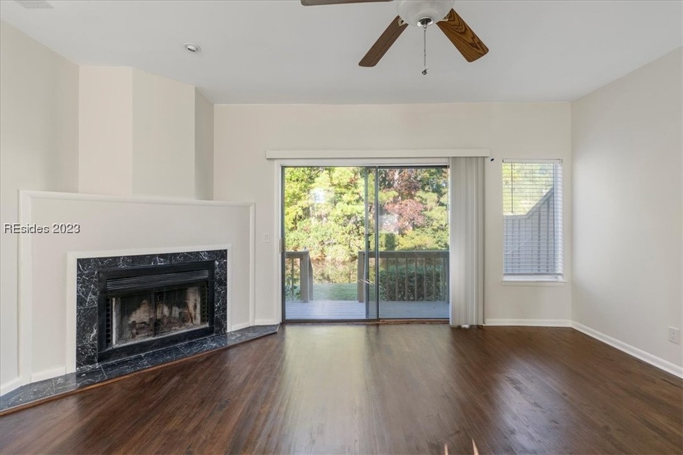 Bright living room with smooth ceiling, dark solid