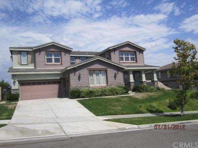 Front view with landscaping and charming covered f