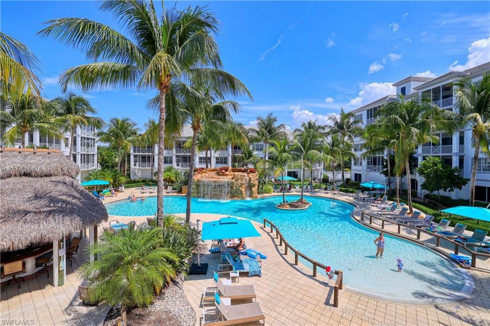 Resort Pool with waterfall and seasonal Chickee Hu