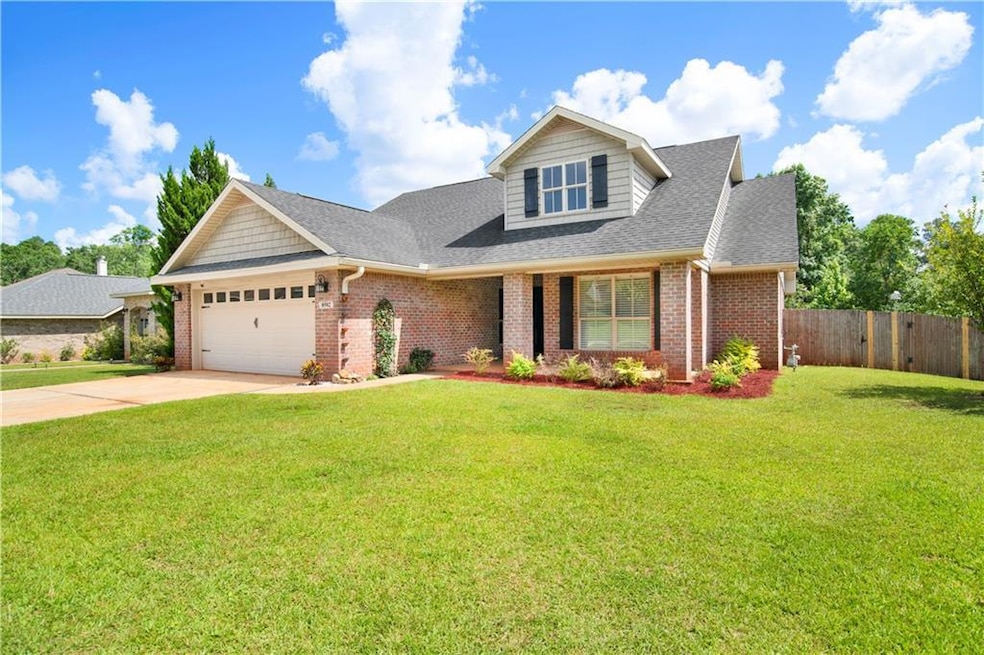View of front of home with a garage, brick siding, driveway, and a shingled roof