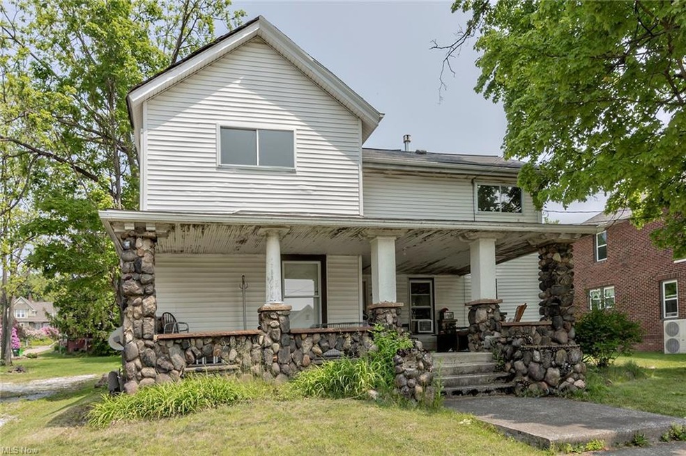 Front of triplex with grand front porch