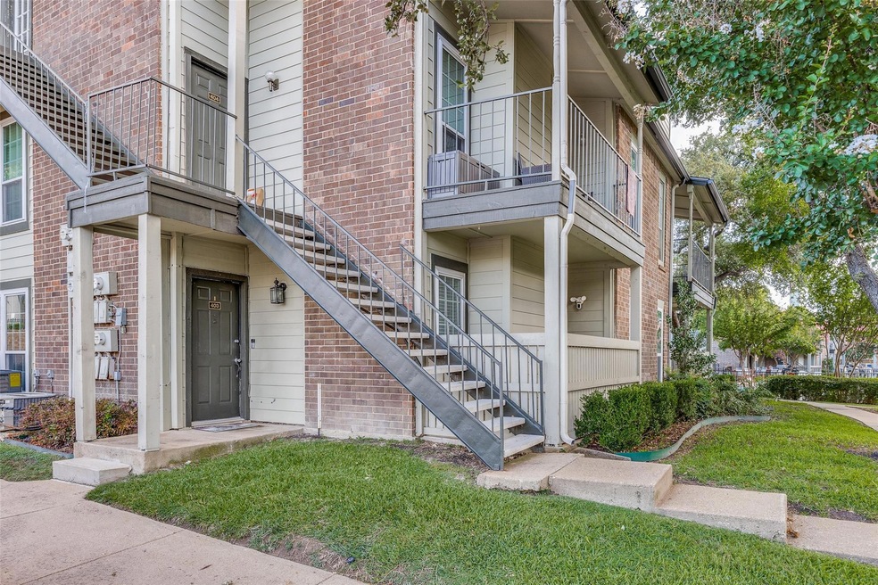 View of exterior entry with a lawn