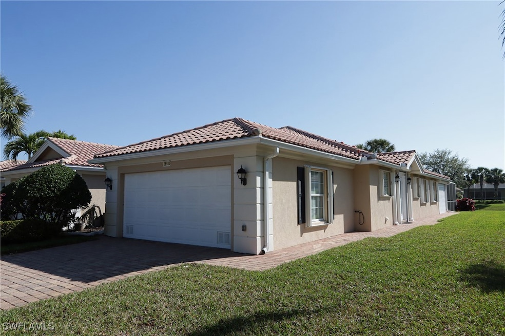 View of side of property featuring stucco siding,