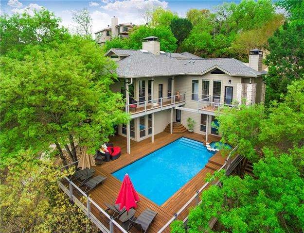 Drone view of the gorgous tree house back and pool