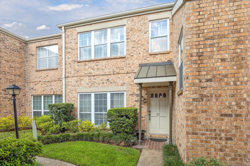Charming two-story brick townhome tucked into a pe