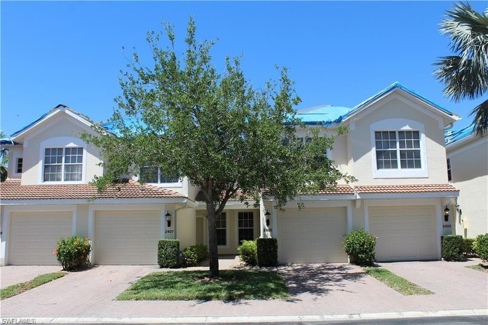 View of front of property with a garage