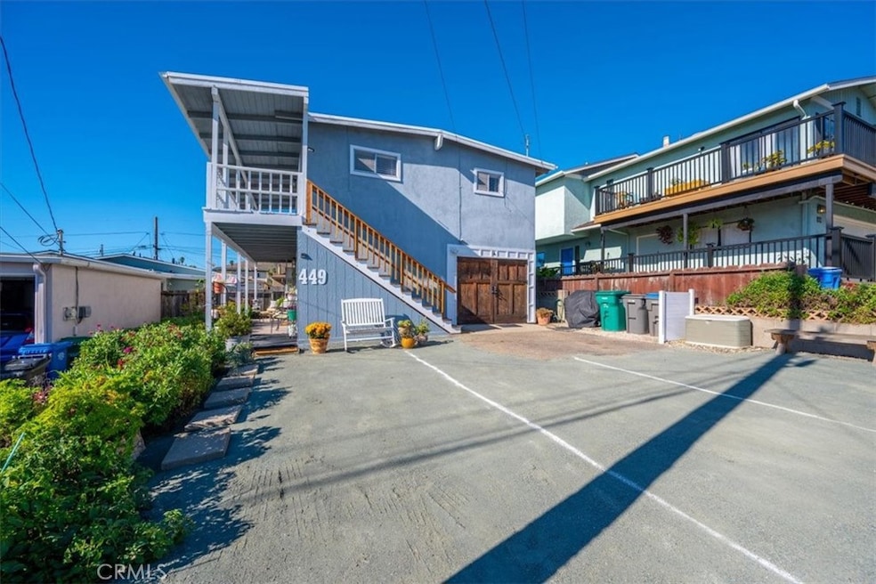 Classic Morro Bay Beach Cottage offering Ocean and Morro Rock Views.  Upstairs there are 2 bedrooms, 2 baths,
living room, kitchen and dining area