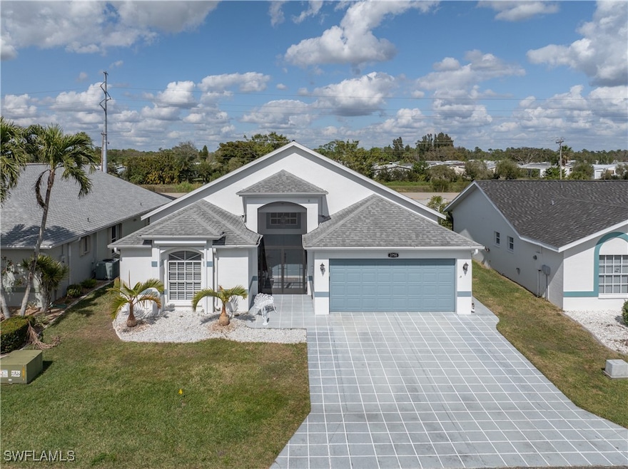 View of front of property with a garage and a fron