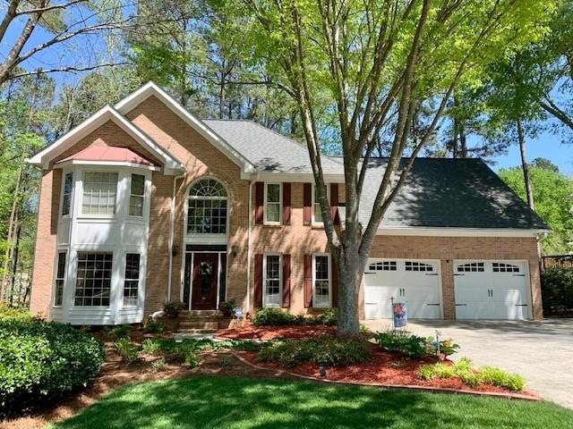 Professionally Landscaped & 2-3 car side driveway 