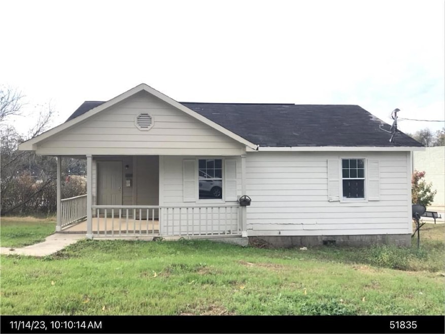 View of front of home with covered porch and a fro