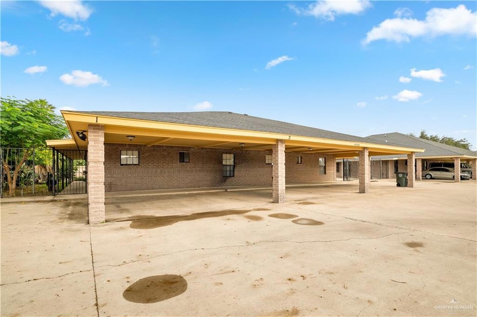 Back of house with roof with shingles and brick siding