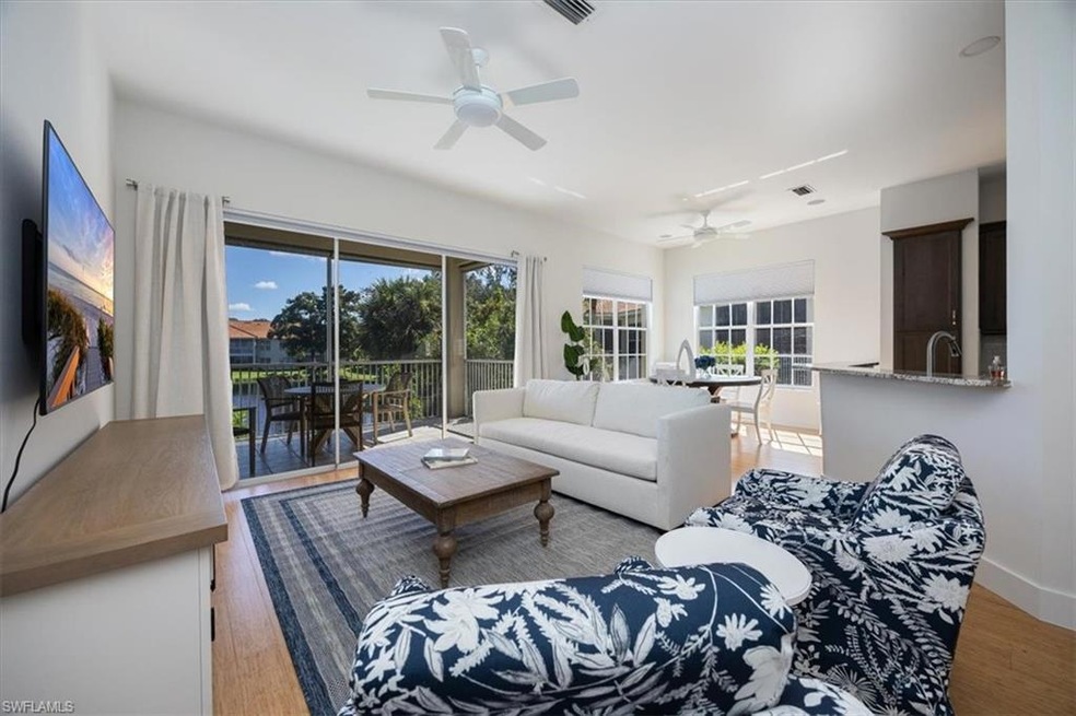 Living room with light hardwood / wood-style floor