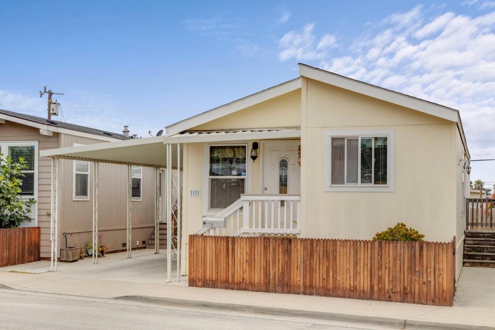 Front of double wide mobile in 55+ park, with smal