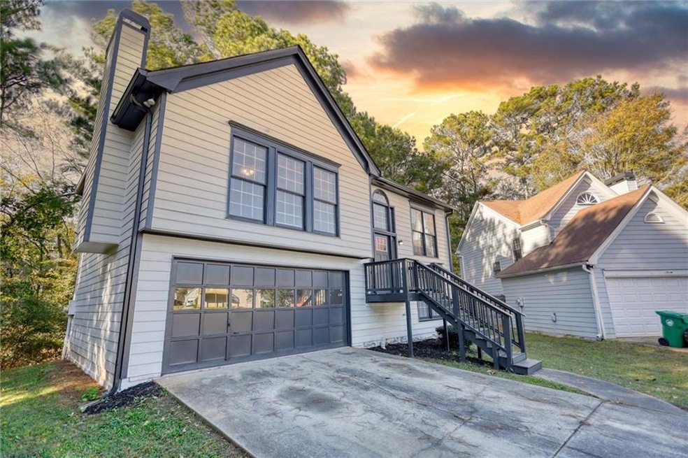 View of front of property featuring a garage