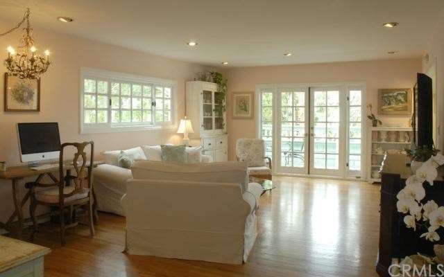 Living room looks out to deck and the view.