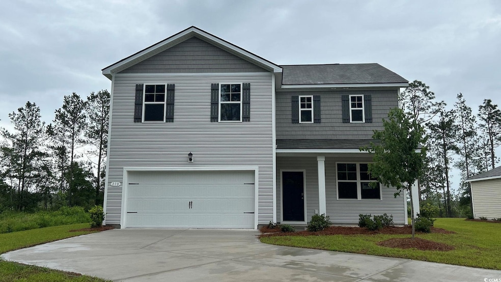View of front facade featuring concrete driveway, a garage, a front lawn, and a shingled roof