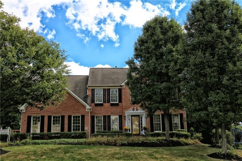 Welcome home to this stunning three sided brick ho