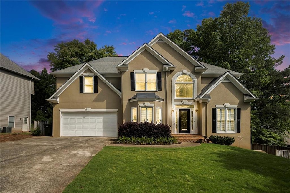 Traditional-style home featuring stucco siding, co