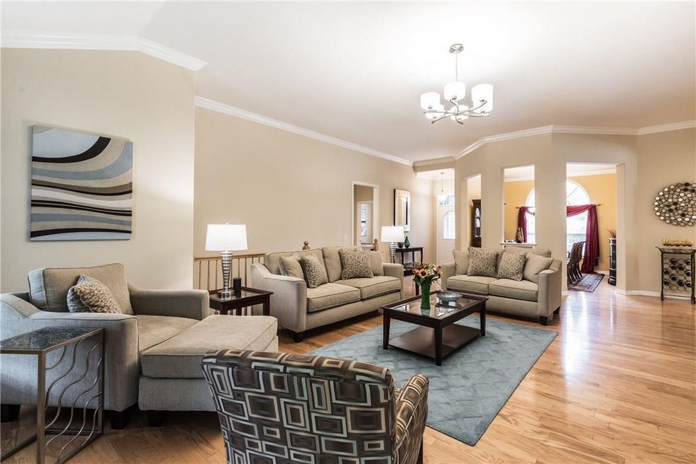 Pristine, natural hardwood floors throughout living room, dining room and kitchen. Open, spacious floor plan