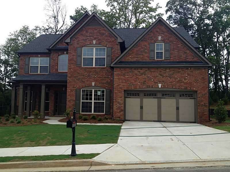 Exterior Front. Three sides brick with covered fro
