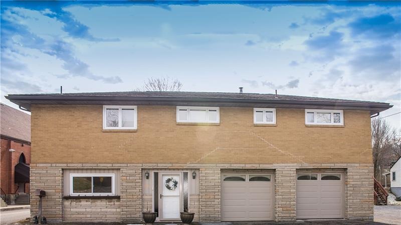 Welcome to 2098 North Road, a brick and stone rais