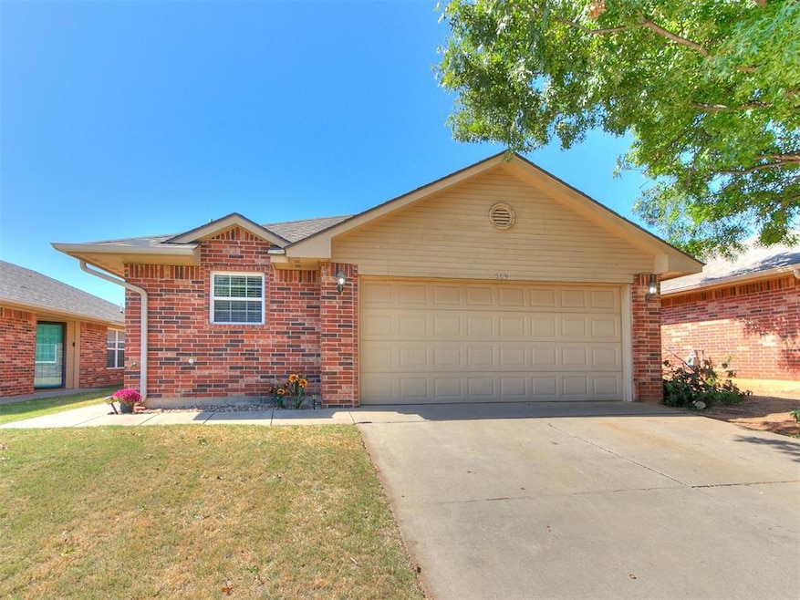 Single story home with a front lawn and a garage