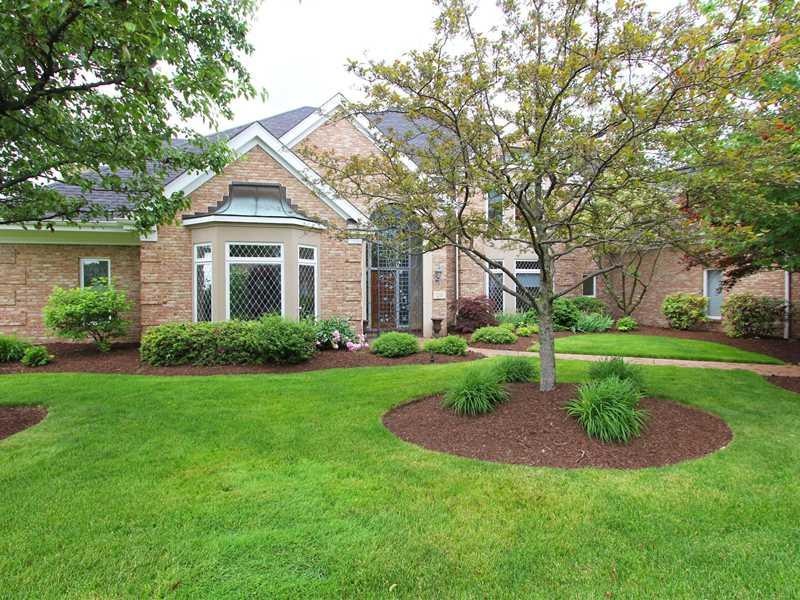 Exterior Front. Lush landscaping surrounds this st