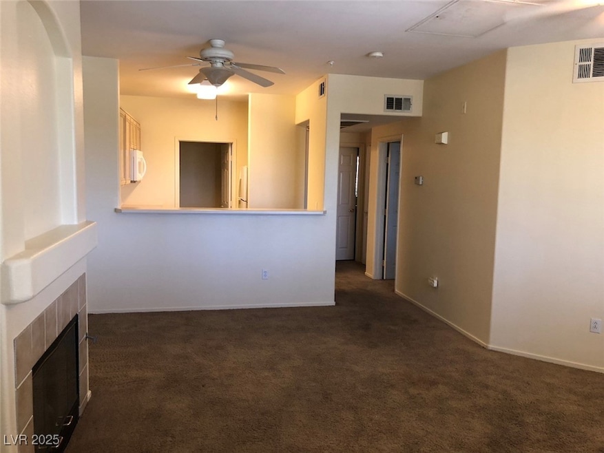 Unfurnished living room with dark carpet, a ceilin