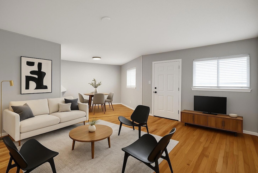 Living room featuring light wood-type flooring an