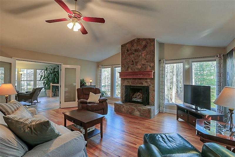 great room with hard wood floors, tons of natural 