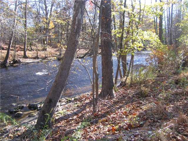 Exterior Back. Fall view Pomperaug River in the ba