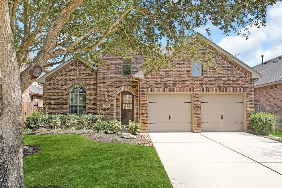 Welcome home to 2927 Fair Chase Drive located in Firethorne and zoned to Katy ISD. This stunning home has lovely curb appeal, a well-manicured lawn, beautiful landscaping, brick elevation, dark stained front door with glass detailing, beautiful outdoor lanterns, and a double wide driveway.