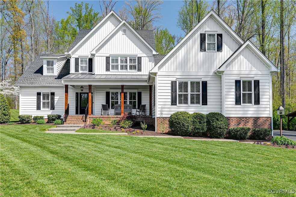 Front of home featuring covered front porch and ir