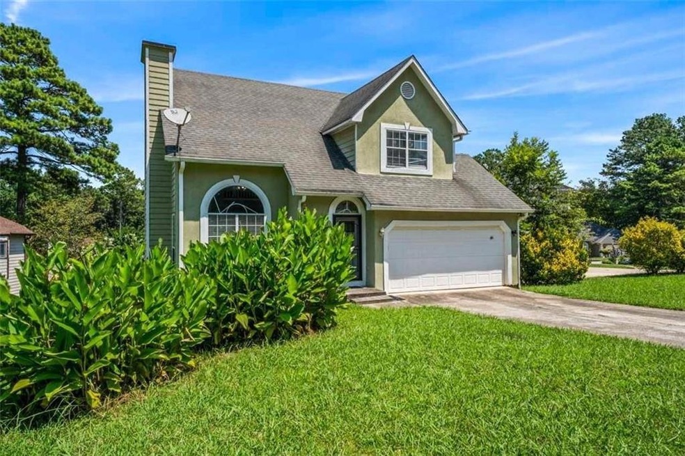 View of front of house featuring a garage and a fr