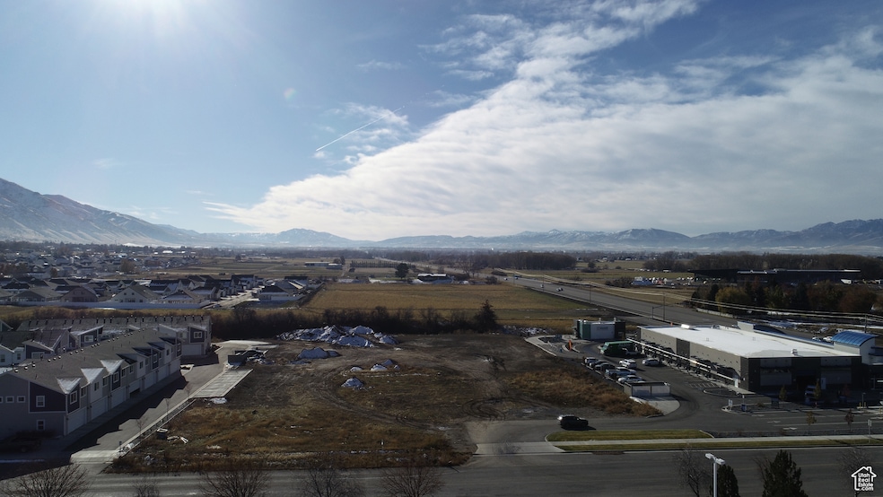 Birds eye view of property with a mountain view